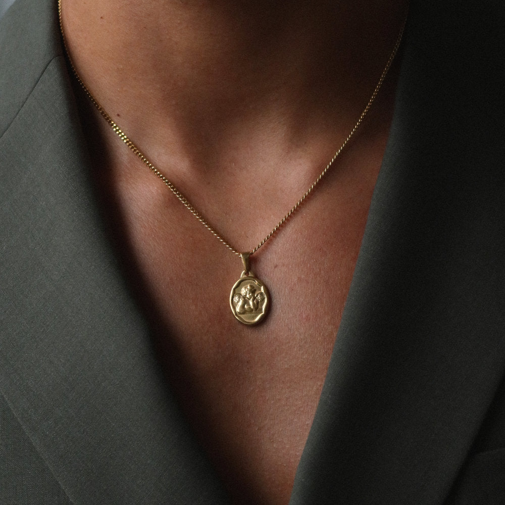 men women gold necklace with cherub medallion pendant from Rush, designed with engraved detailing and a refined polished finish for versatile wear. trendy popular angel necklace 