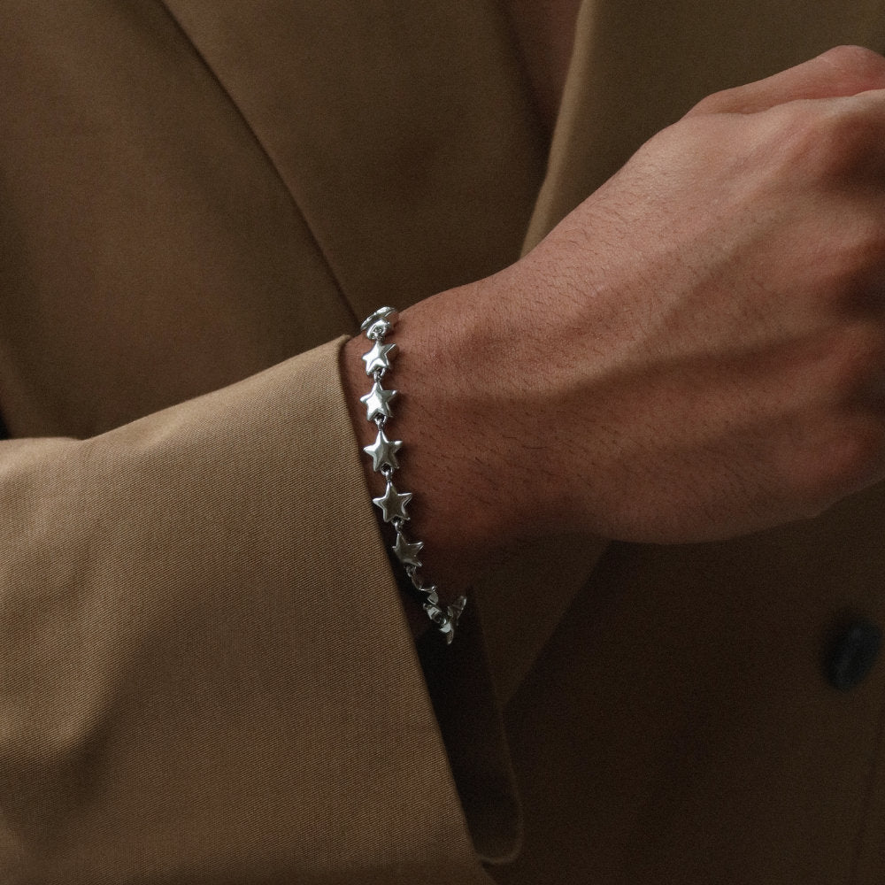 Rush silver star pattern shiny heavy weight trendy popular men women bracelet Unisex silver star bracelet from Rush with interlinked star charms and adjustable clasp, offering a playful yet minimalist statement look