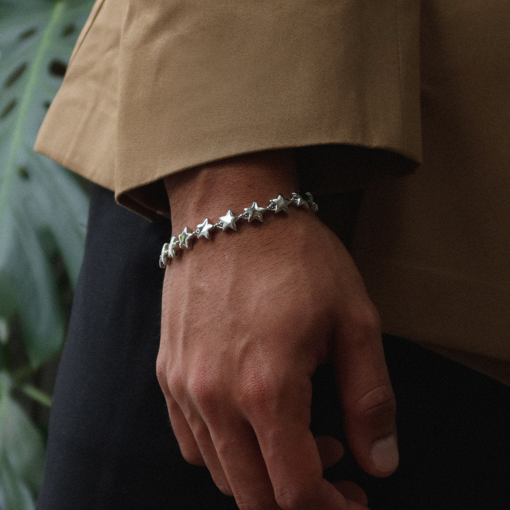 Rush silver star pattern shiny heavy weight trendy popular men women bracelet Unisex silver star bracelet from Rush with interlinked star charms and adjustable clasp, offering a playful yet minimalist statement look