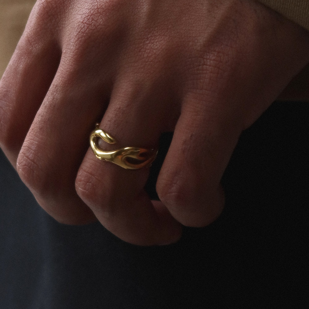 Unisex gold open ring from Rush with an abstract fluid shape, polished finish, and bold sculptural design for statement styling men women popular trendy sleek irregular shaped ring 