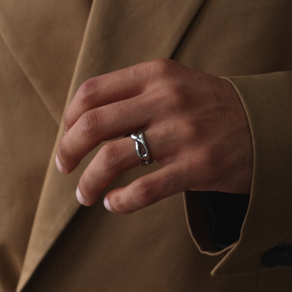 Unisex silver open ring from Rush with an abstract fluid shape, polished finish, and bold sculptural design for statement styling men women popular trendy sleek irregular shaped ring 