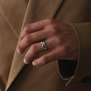 Unisex silver open ring from Rush with an abstract fluid shape, polished finish, and bold sculptural design for statement styling men women popular trendy sleek irregular shaped ring 