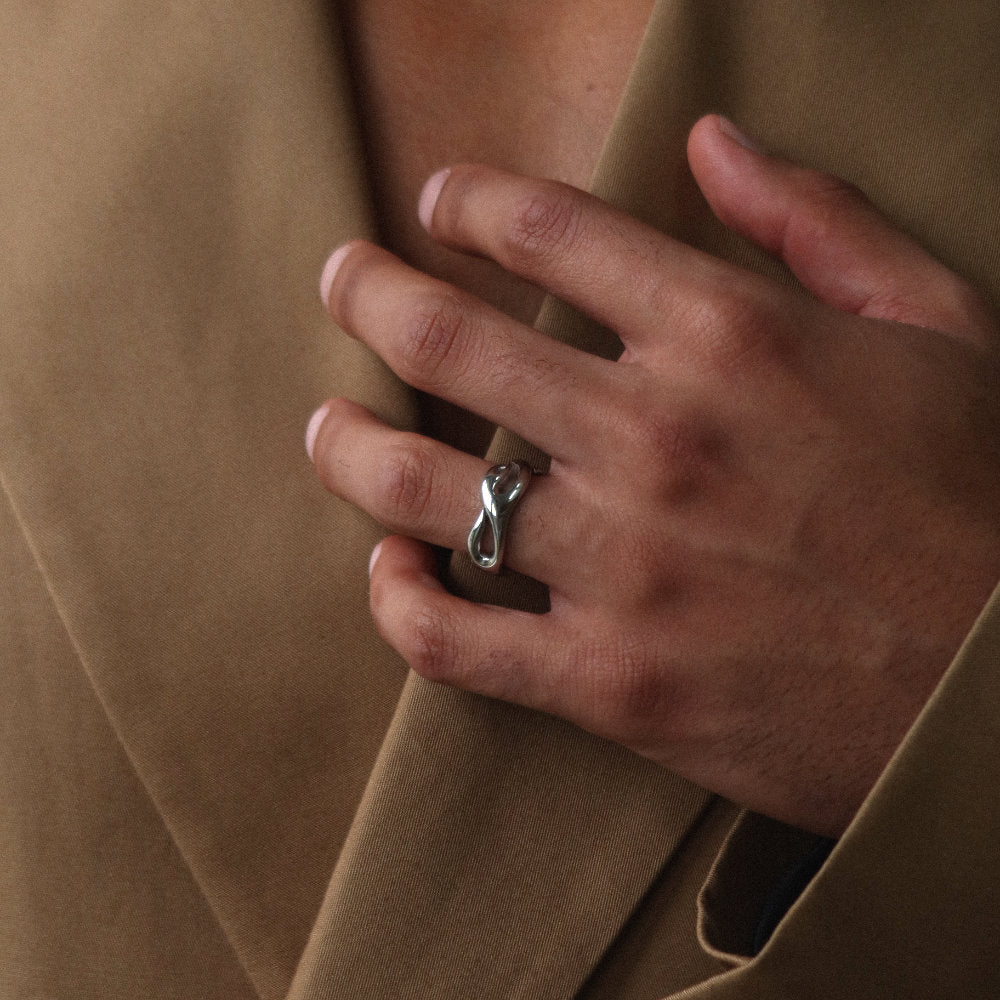 Unisex silver open ring from Rush with an abstract fluid shape, polished finish, and bold sculptural design for statement styling men women popular trendy sleek irregular shaped ring 