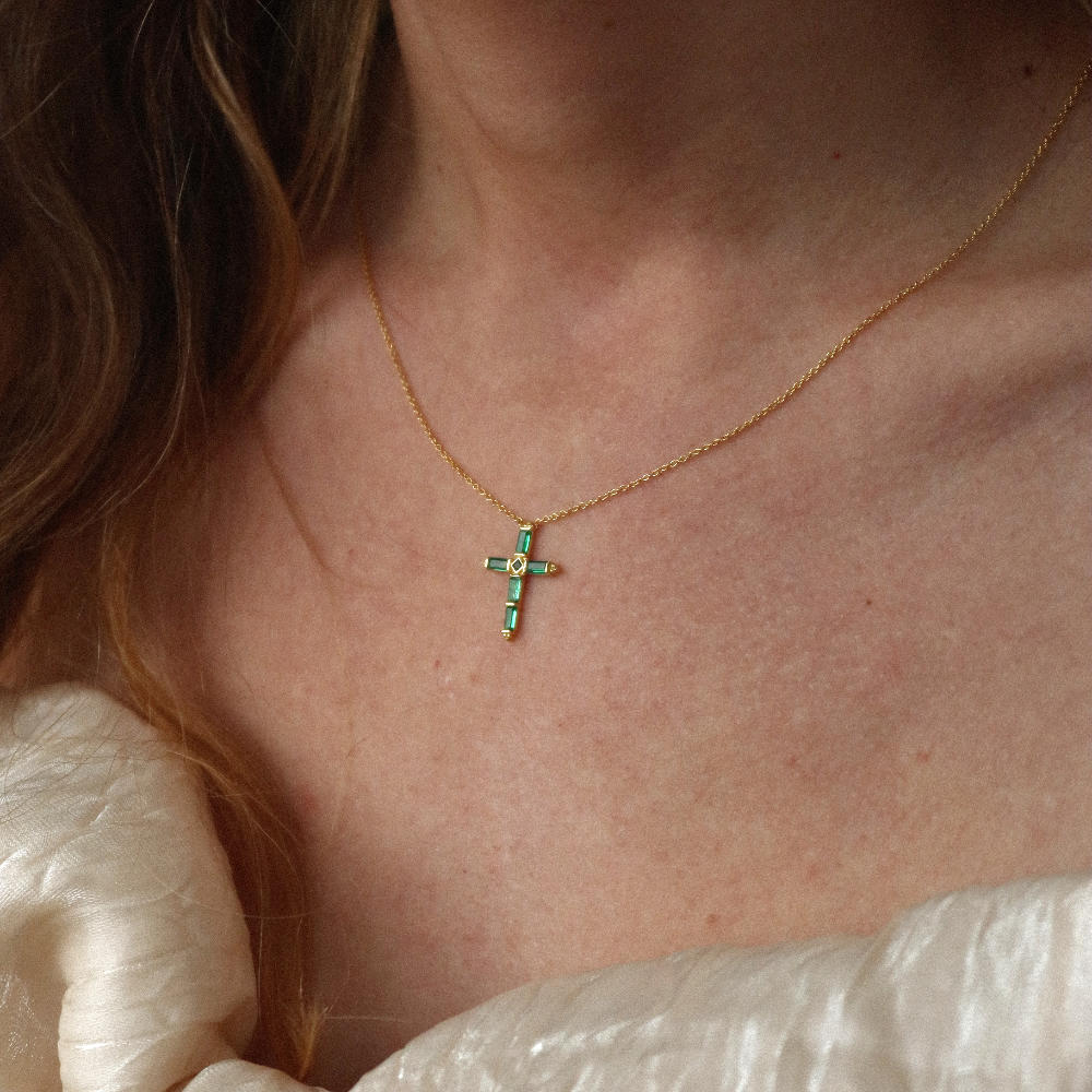 Rush gold green emerald stones men women chic party popular trendy cross necklace Unisex silver cross pendant necklace from Rush featuring baguette-cut green stones in a modern polished setting, designed for statement wear.