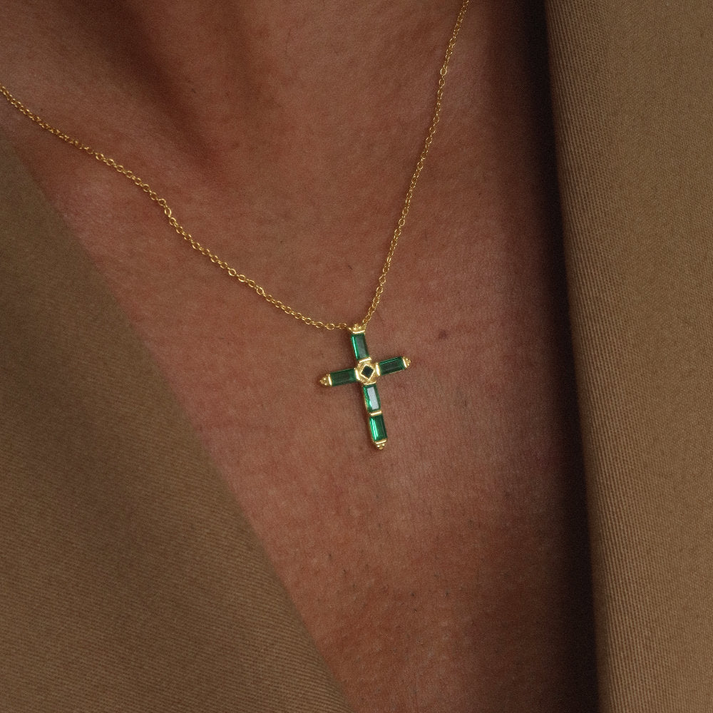 Rush gold green emerald stones men women chic party popular trendy cross necklace Unisex silver cross pendant necklace from Rush featuring baguette-cut green stones in a modern polished setting, designed for statement wear.