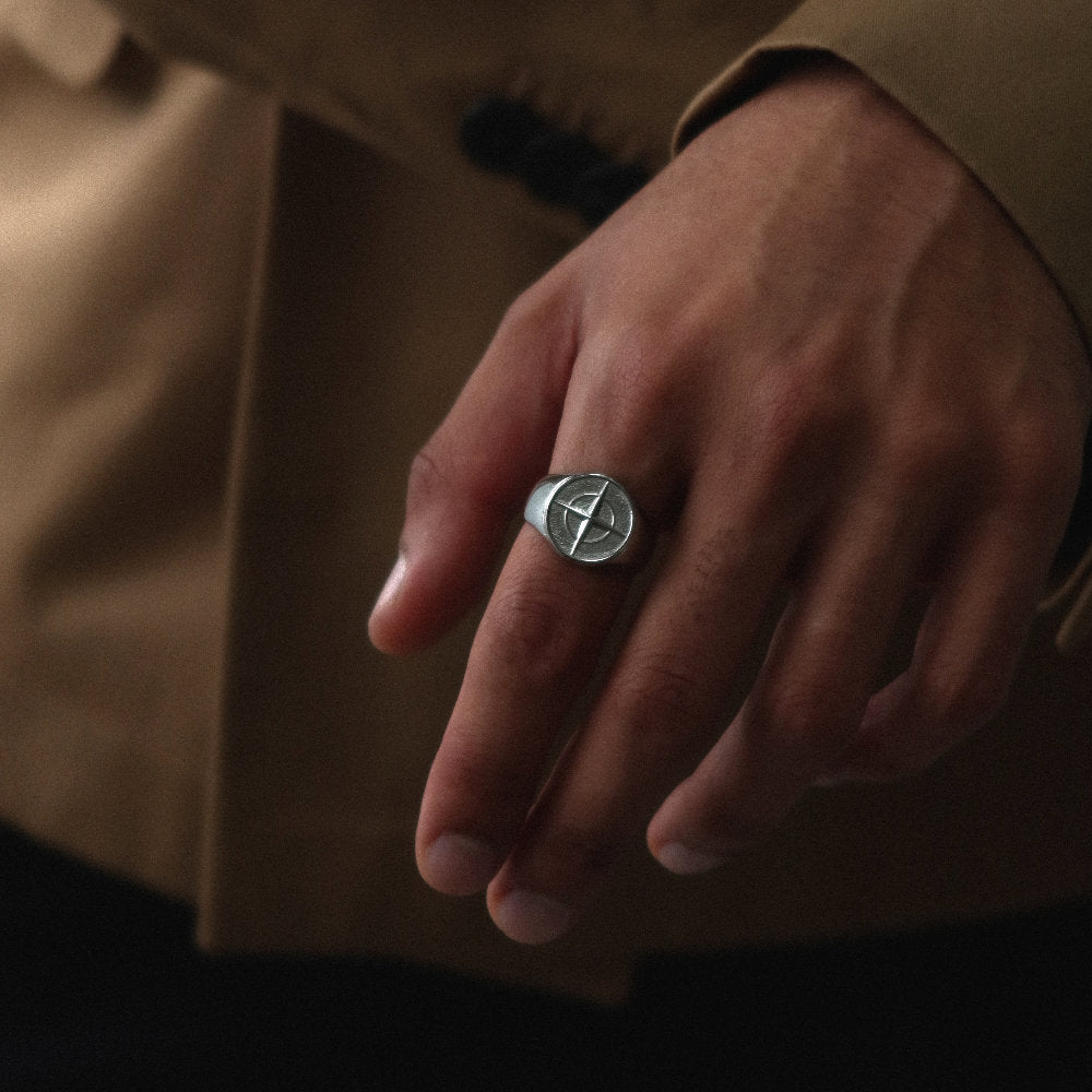 Unisex silver compass signet ring from Rush with an engraved compass design, polished finish, and bold modern style for everyday or statement wear. men women trendy popular sleek ring 