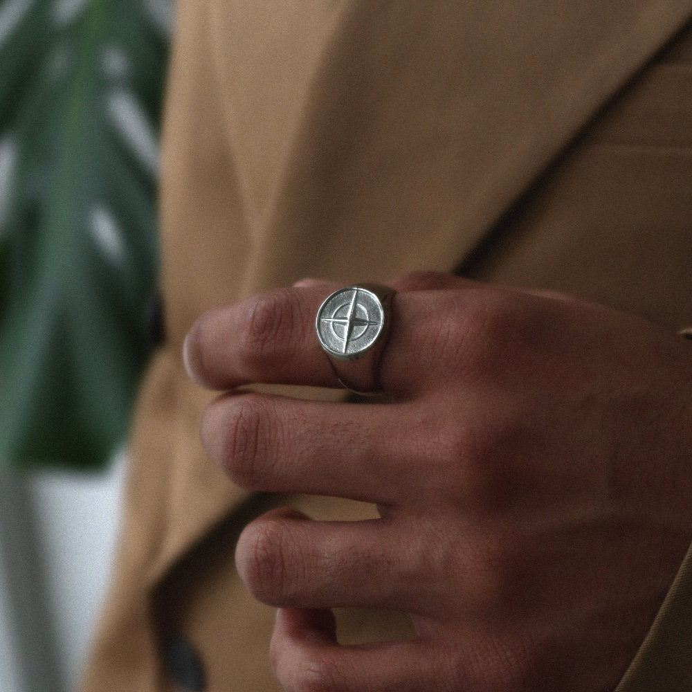 Unisex silver compass signet ring from Rush with an engraved compass design, polished finish, and bold modern style for everyday or statement wear. men women trendy popular sleek ring 