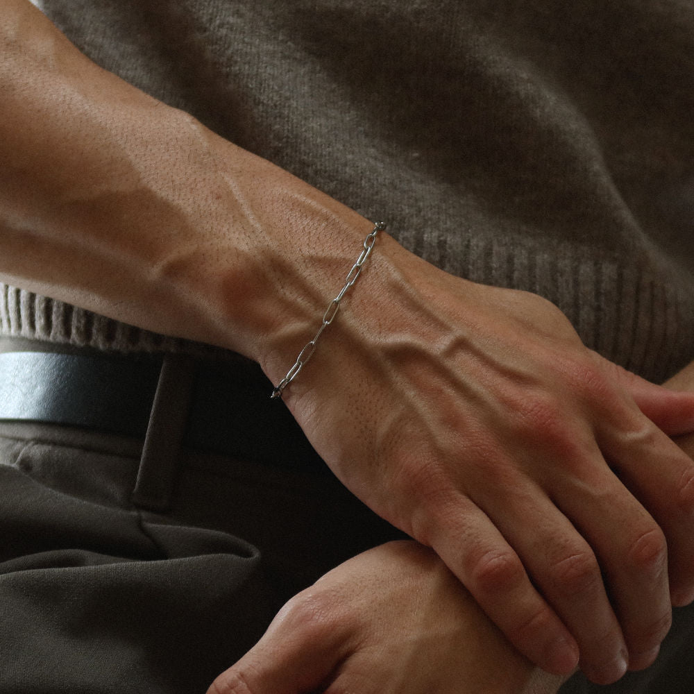 Rush paper clip chain silver men women popular trendy sleek bracelet Unisex silver elongated link bracelet from Rush featuring a sleek paperclip chain design, perfect for layering or solo statement styling.