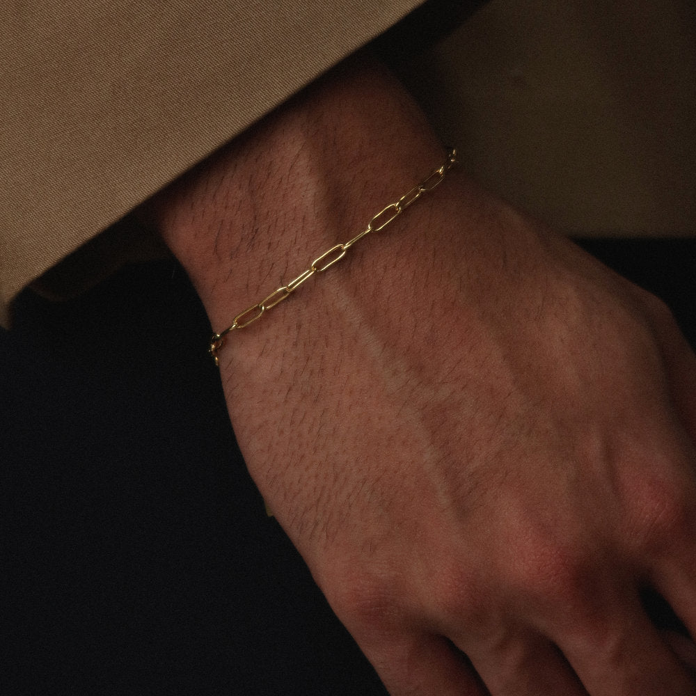 Rush paper clip chain gold men women popular trendy sleek bracelet Unisex silver elongated link bracelet from Rush featuring a sleek paperclip chain design, perfect for layering or solo statement styling.