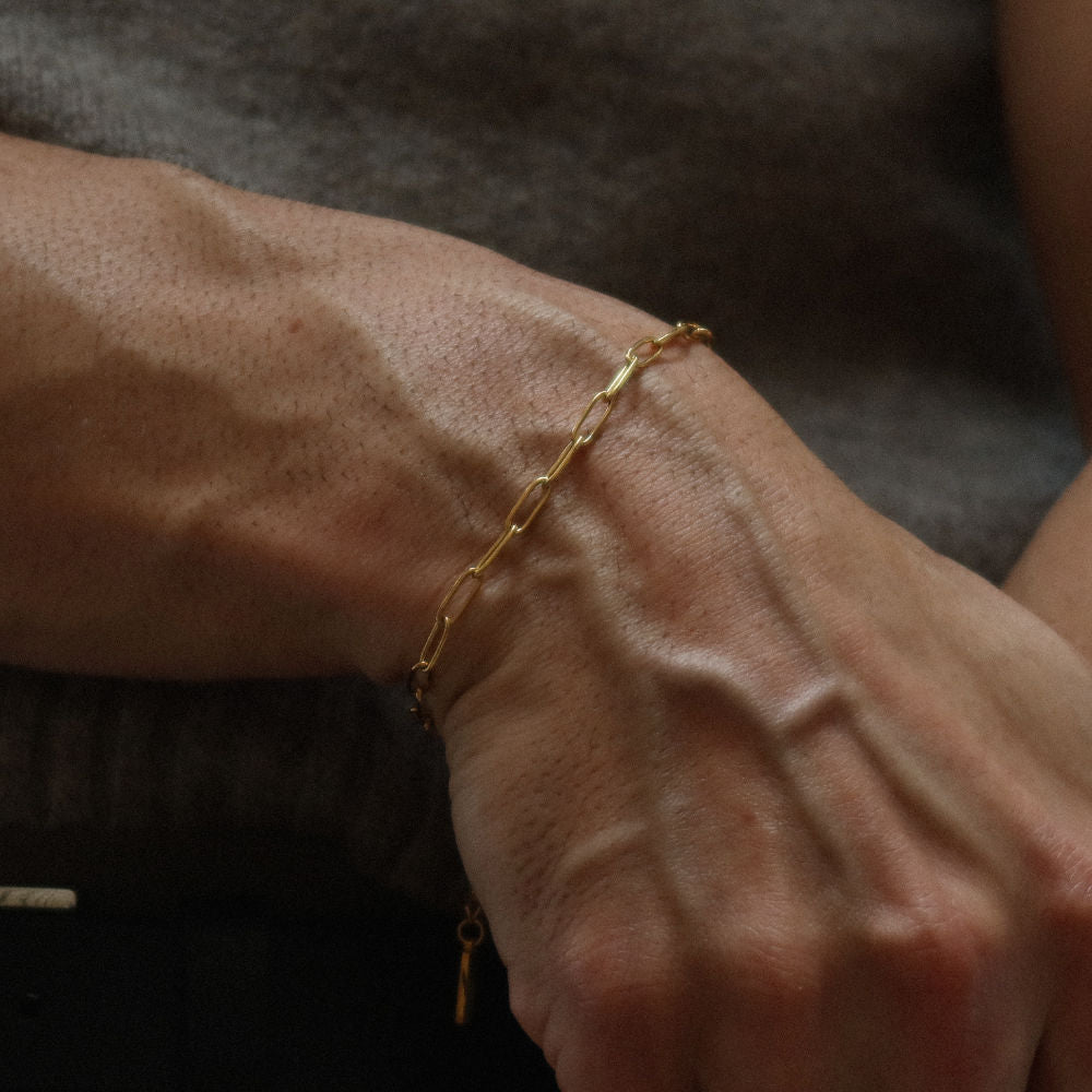 Rush paper clip chain gold men women popular trendy sleek bracelet Unisex silver elongated link bracelet from Rush featuring a sleek paperclip chain design, perfect for layering or solo statement styling.