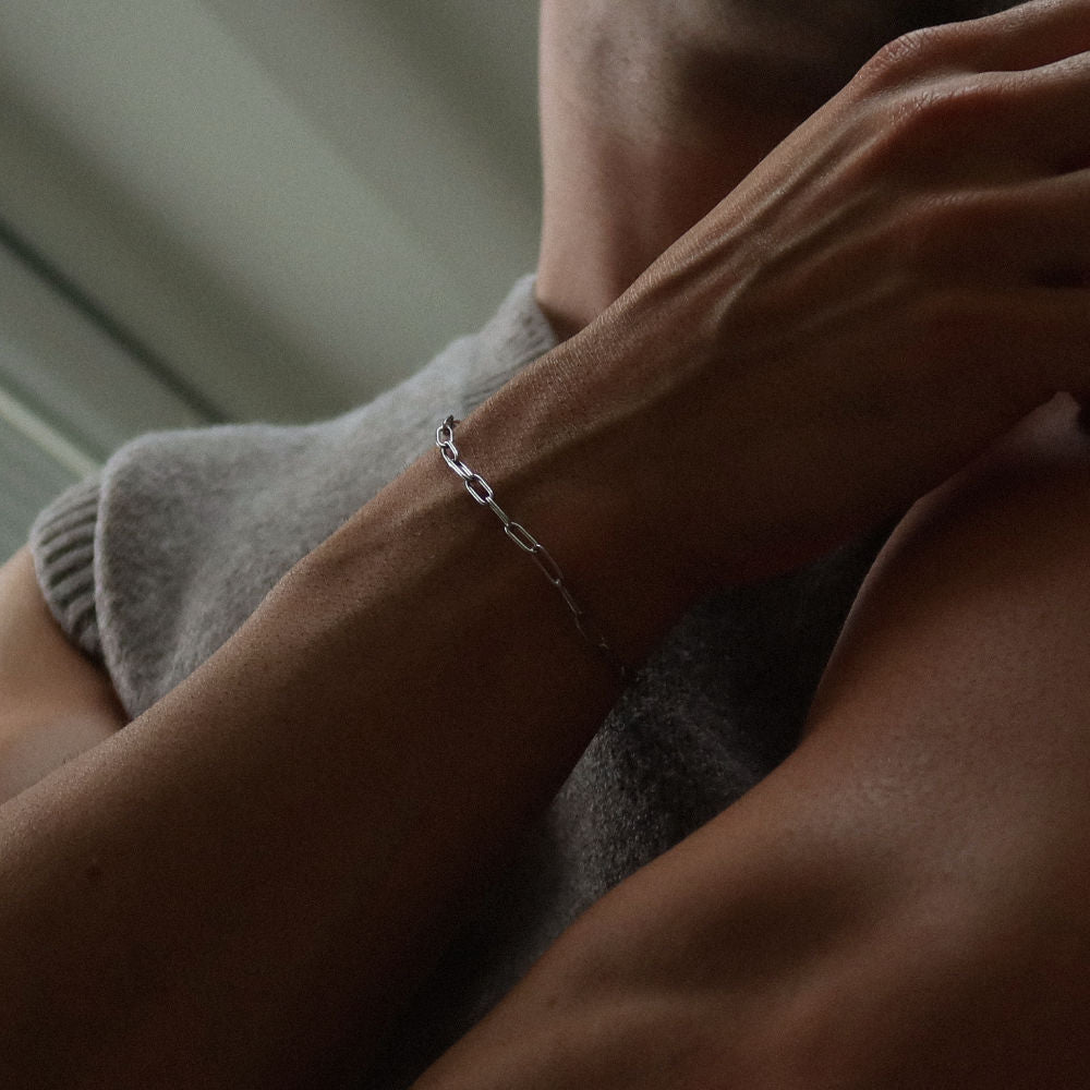 Rush paper clip chain silver men women popular trendy sleek bracelet Unisex silver elongated link bracelet from Rush featuring a sleek paperclip chain design, perfect for layering or solo statement styling.