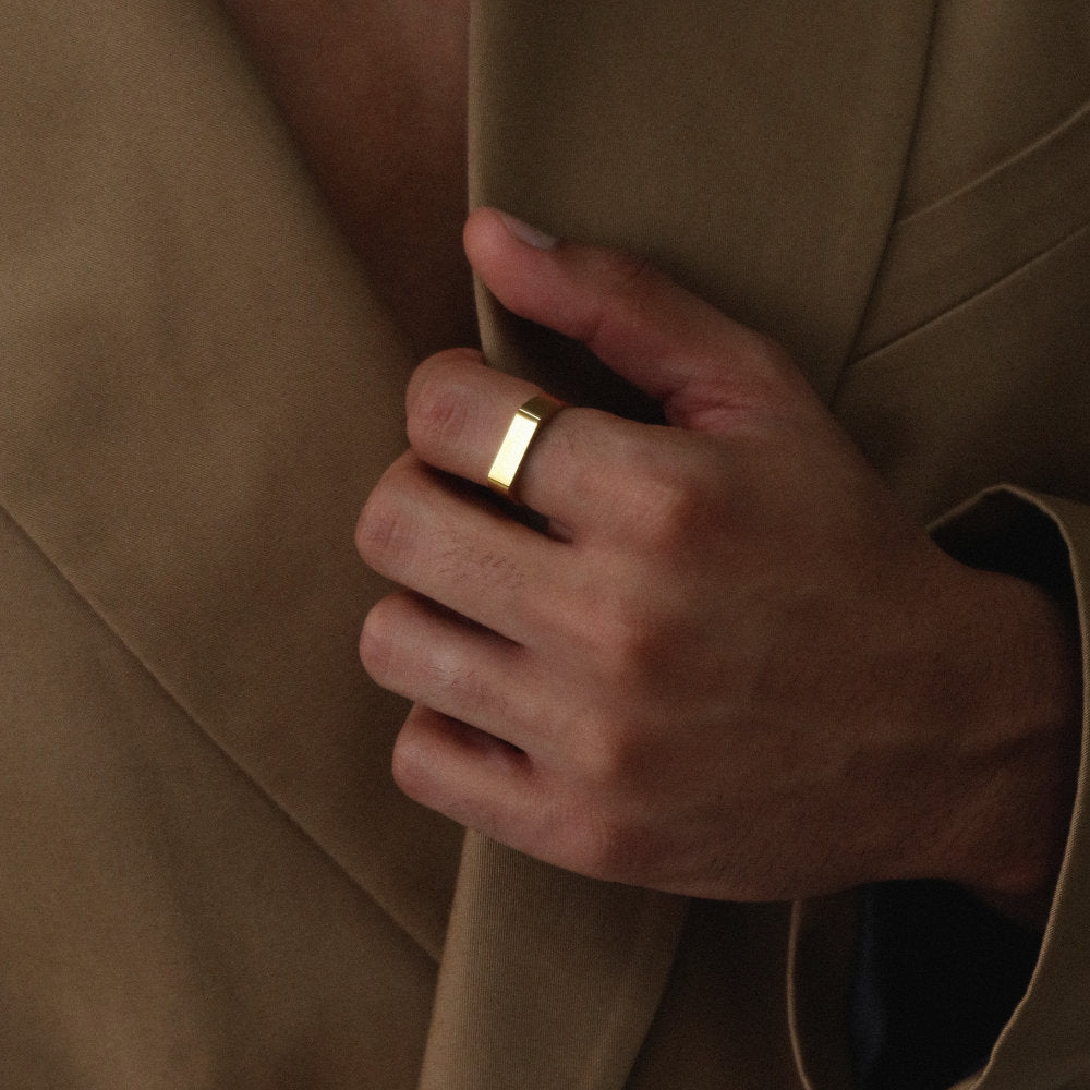 Minimalist unisex gold rectangular signet ring from Rush, designed with clean lines and a polished finish, perfect for everyday wear or statement styling. men women popular trendy sleek ring