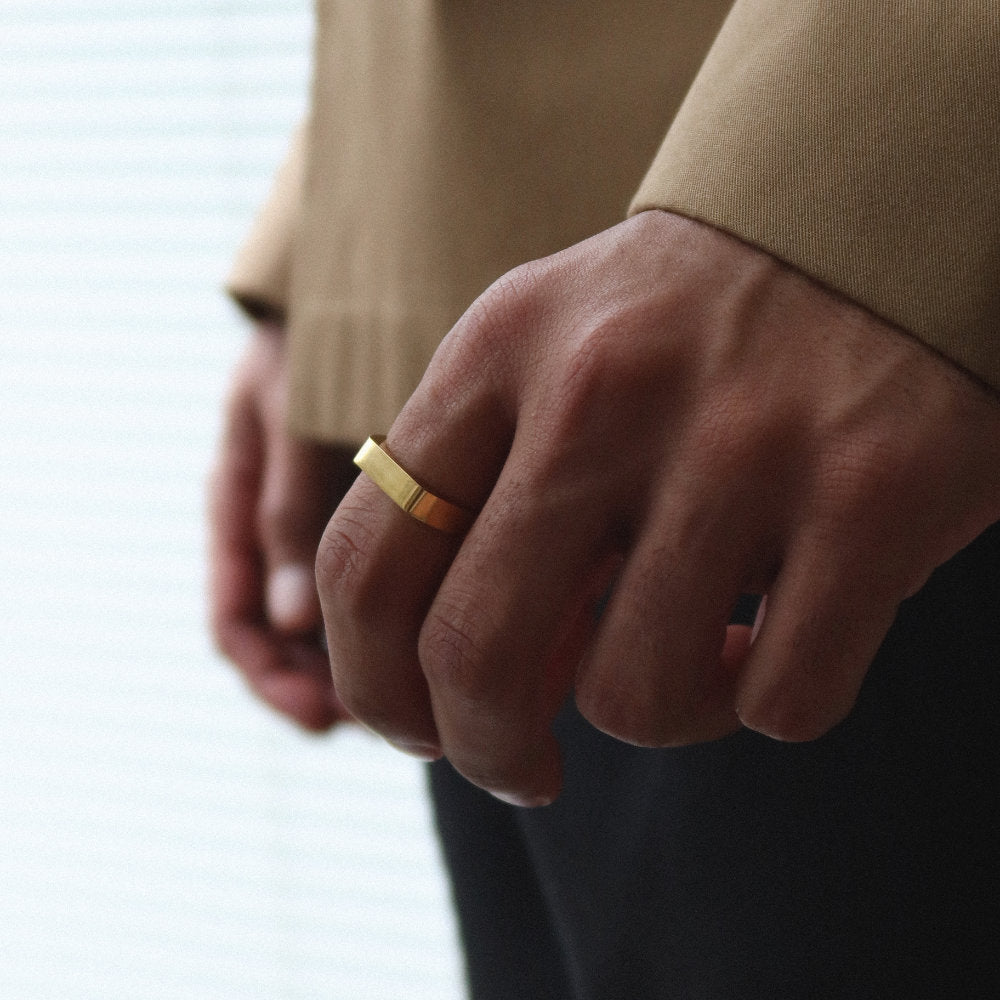 Minimalist unisex gold rectangular signet ring from Rush, designed with clean lines and a polished finish, perfect for everyday wear or statement styling. men women popular trendy sleek ring