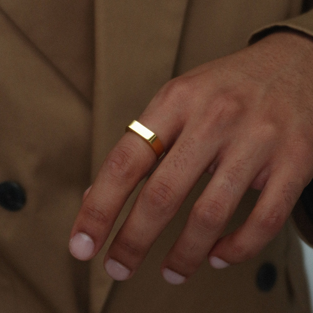 Minimalist unisex gold rectangular signet ring from Rush, designed with clean lines and a polished finish, perfect for everyday wear or statement styling. men women popular trendy sleek ring