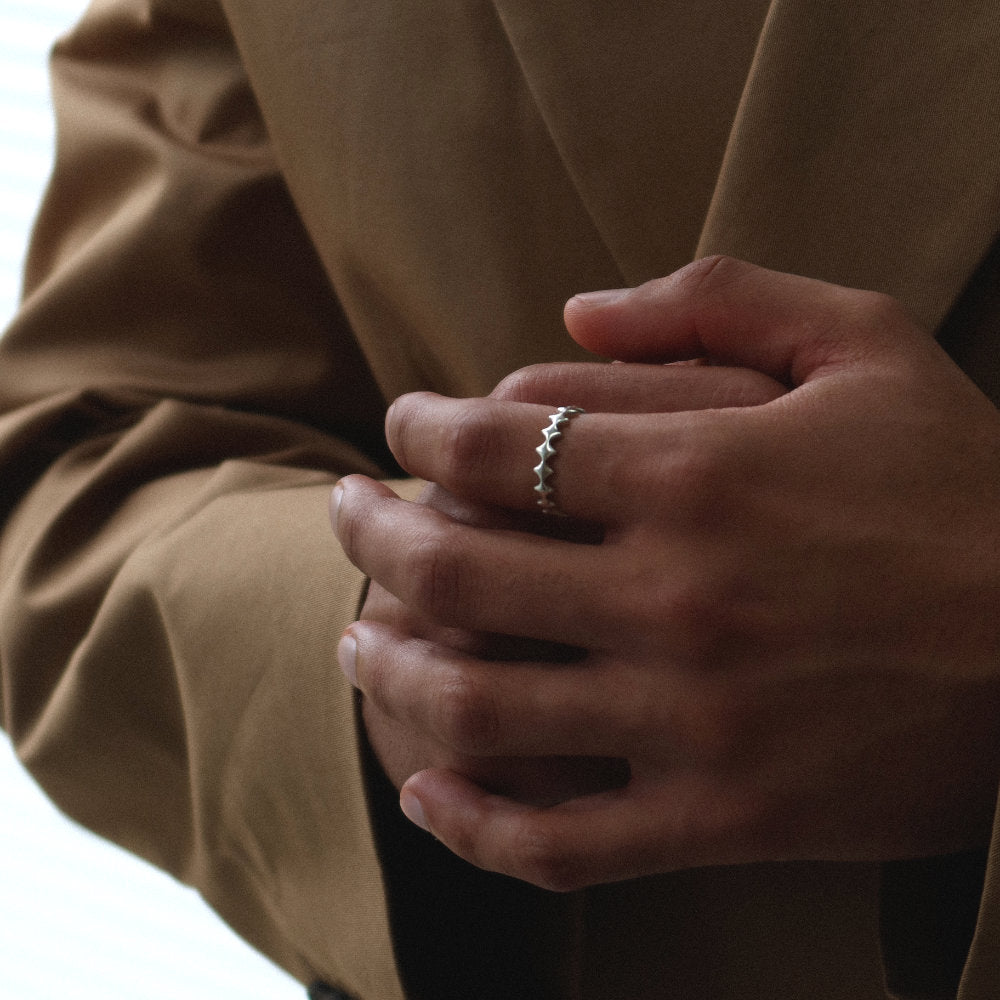 Rush silver ring with geometric design men women trendy popular ring 
Unisex silver scalloped band ring from Rush with a repeating geometric edge design and polished minimalist finish for everyday wear.