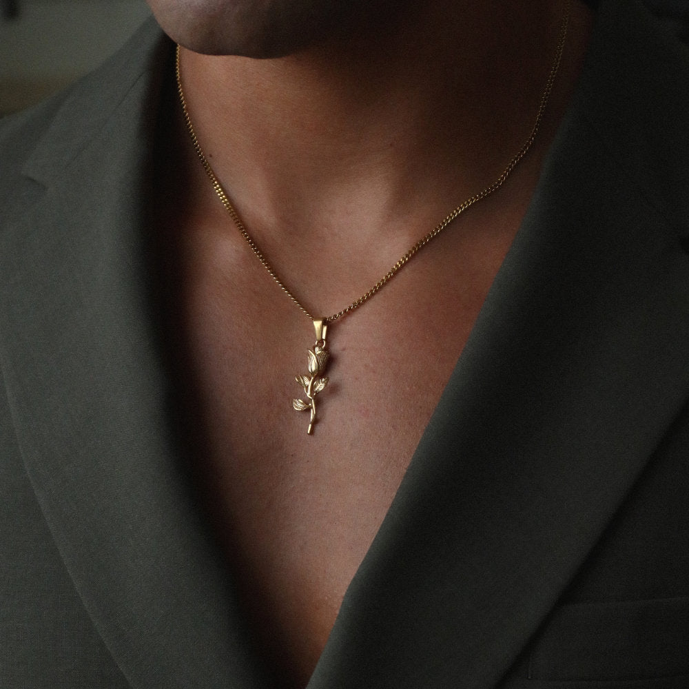 Unisex gold necklace with rose flower pendant from Rush, showcasing a delicate floral design for versatile everyday or evening wear. men women floral trendy popular necklace 